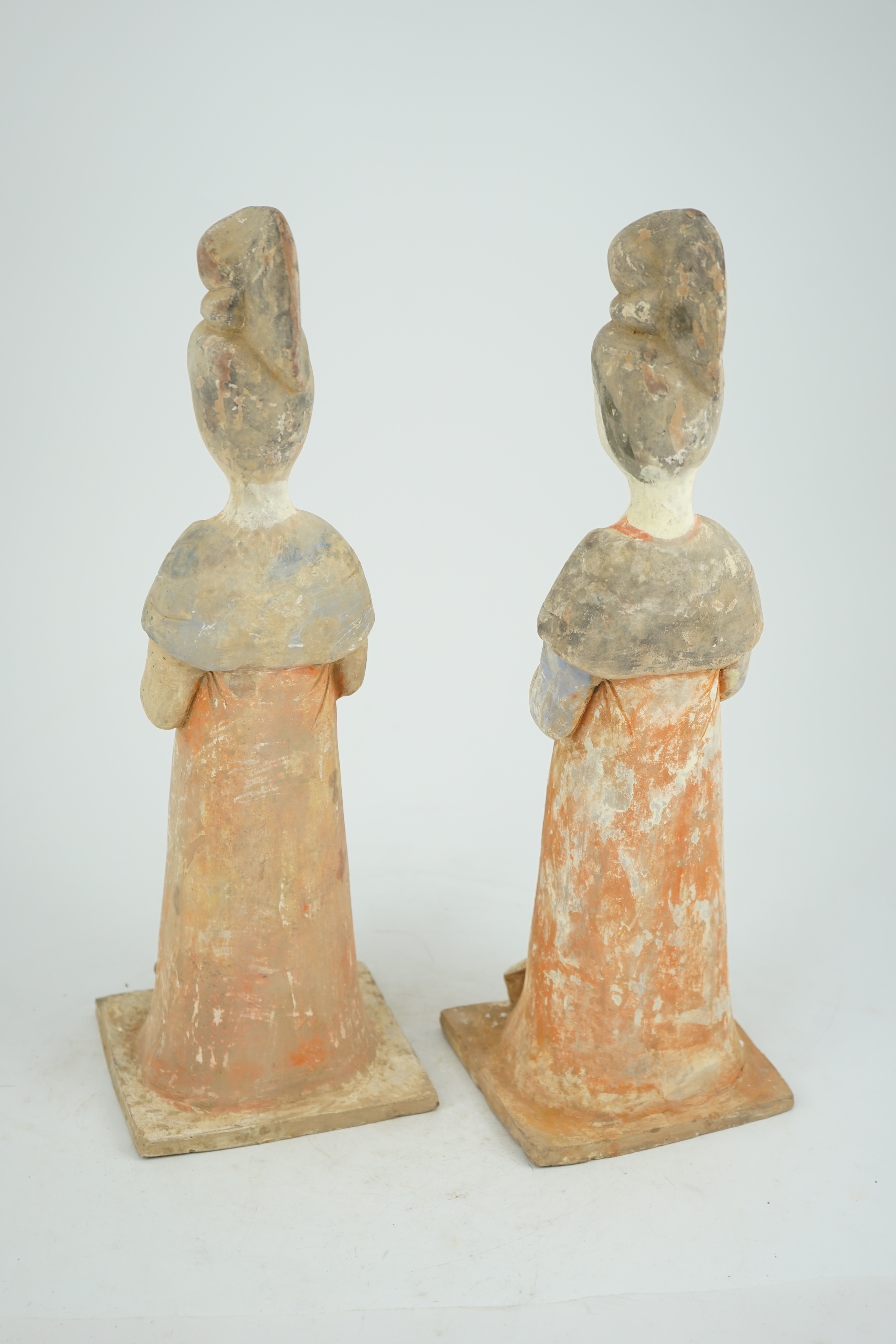 A pair of Chinese Tang style painted pottery ladies, 44.5cm